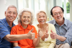 elderly people showing thumbs up