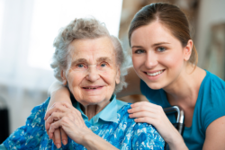 elderly woman with her caregiver